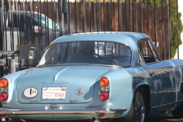 Jay Leno seen driving a vintage Maserati after his serious burn accident