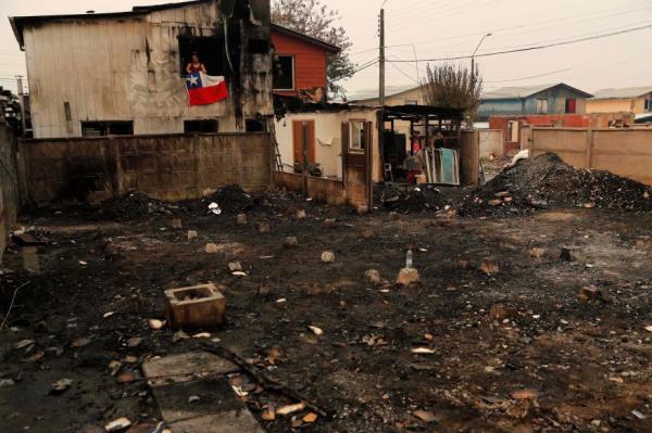 A burnt house is seen after a fire in Puren, Chile on Feb. 4.