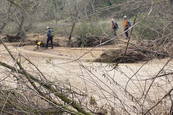 A rescue team searches for Kyle in San Luis Obispo County Wednesday. 