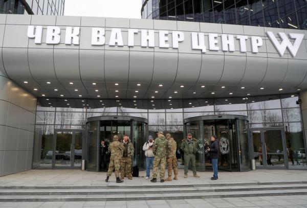 People gather outside PMC Wagner Centre, which is a project implemented by the businessman and founder of the Wagner private military group Yevgeny Prigozhin, during the official opening of the office block in Saint Petersburg, Russia, November 4, 2022. 