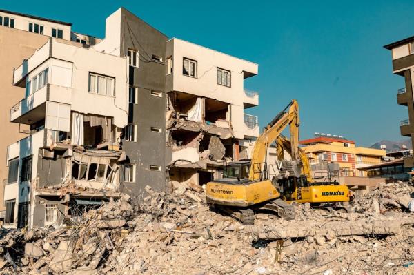 A crane is shown during efforts to recover the baby from the rubble. 