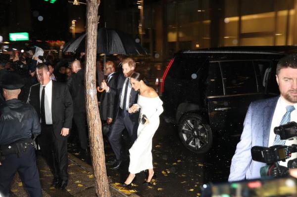 Harry and Meghan arriving at the Hilton Hotel in midtown