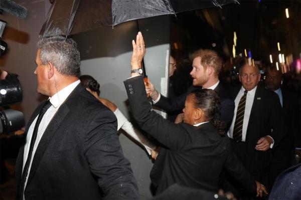 Harry and Meghan arriving at the Hilton Hotel in midtown