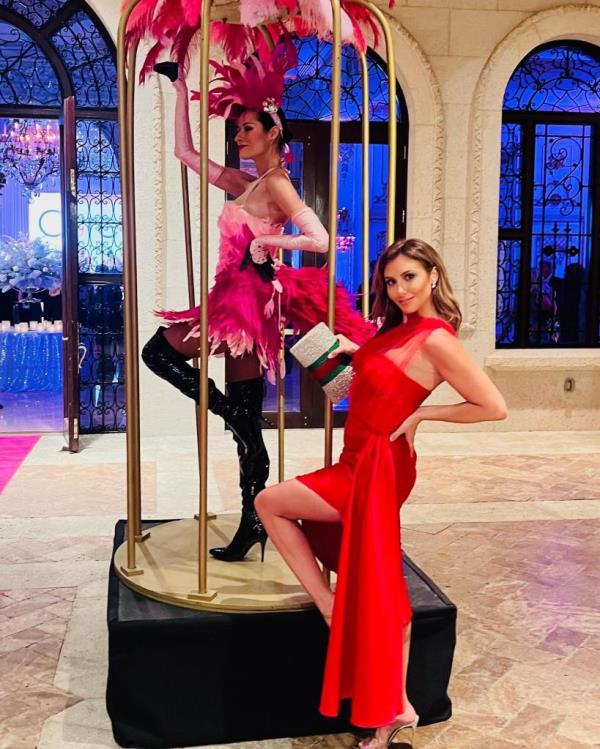 Alina Trump with a cage dancer.