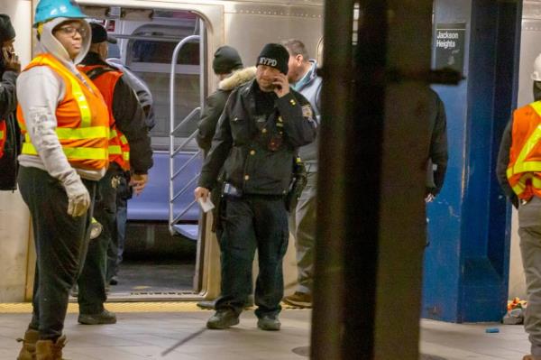 NYPD, FDNY and EMT's at the scene of a person struck by a the Jamaica bound E M F R train at the Jackson Heights - Roosevelt Ave station in Jackson Heights, Queens.