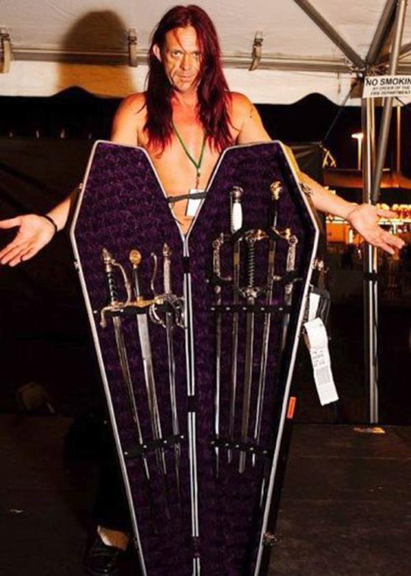 Scott Nelson with coffin-shaped case full of swords