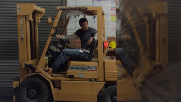 James Marsden sitting in a forklift. 