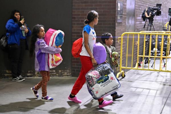 Migrants getting off the bus