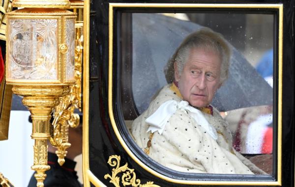 King Charles and Queen Camilla arrive in the Diamond Jubilee State Coach.