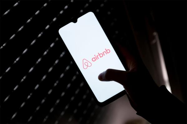 Airbnb logo on smart phone screen