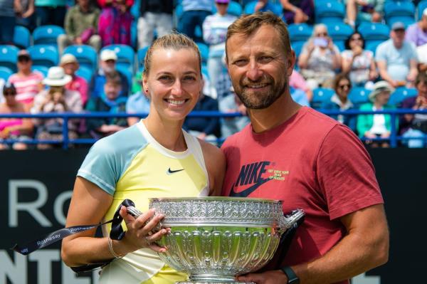 Petra Kvitova of the Czech Republic and boyfriend and coach Jiri Vanek pose with the champion's trophy
