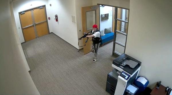 A still image from surveillance video shows what the Metropolitan Nashville Police Department describe as mass shooting suspect Audrey Elizabeth Hale, 28, entering The Covenant School carrying weapons in Nashville, Tennessee, U.S. March 27.