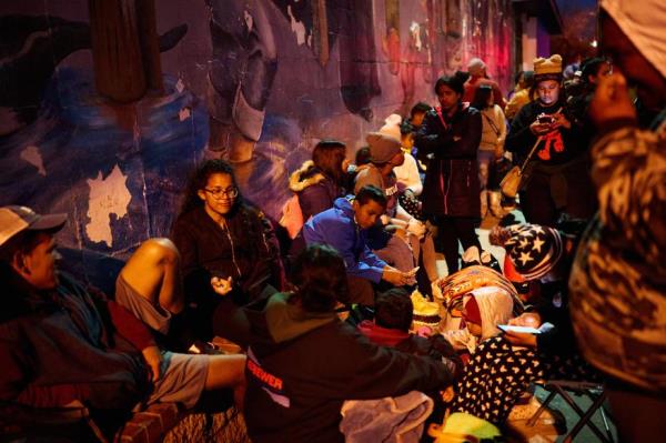 Migrants outside of the shelter at Sacred Heart Church in El Paso on January 6, 2023.