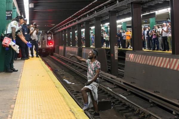 A man on the subway tracks.