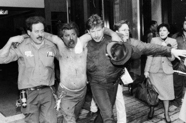 An injured man is helped away from the scene of a bombing at the World Trade Center.