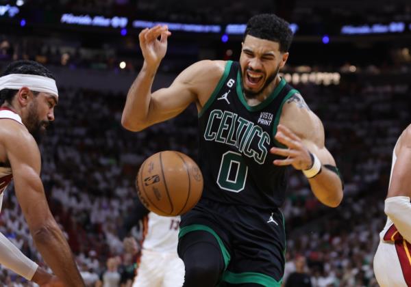 Jayson Tatum battles for the ball during the second quarter against the Miami Heat
