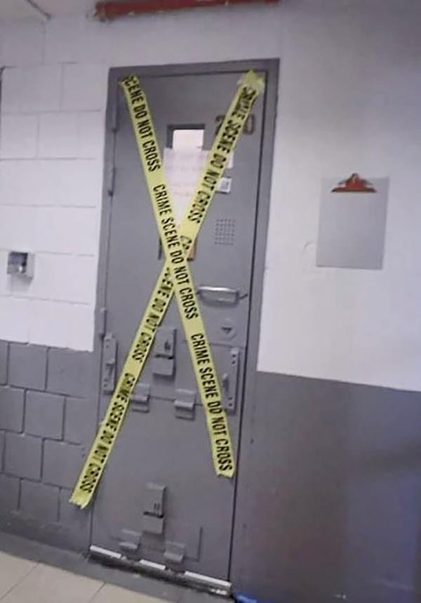 The door to Epstein's cells is seen with caution tape over it after his suicide.