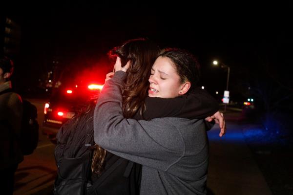 Michigan State University students hug during an active shooter situation on campus on Feb. 13, 2023 in Lansing, Michigan.