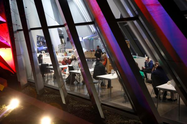 People are seen inside the Broad Art Museum near Berkey Hall on the campus of Michigan State University as they shelter in place, late Monday, Feb. 13, 2023, in East Lansing, Mich.