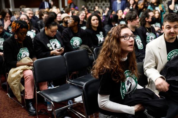 Starbucks employees attend an organizing meeting