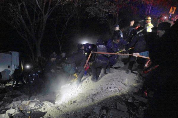 In this handout picture released by the Secretary of Security and Citizen Protection of Nayarit, rescuers work at the site of a bus accident in Compostela, Nayarit state, Mexico, on April 30, 2023.