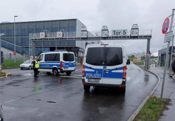 Police emergency vehicles are parked at a Mercedes-Benz plant in Sindelfingen, Germany, on May 11, 2023.