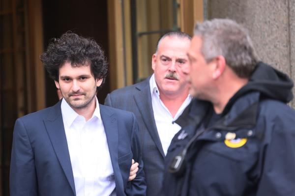 Sam Bankman-Fried leaves court.