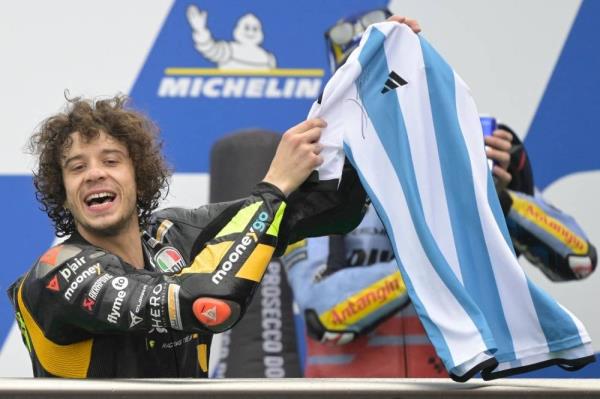 Ducati Italian rider Marco Bezzecchi shows the Argentine jersey signed by Lio<em></em>nel Messi he was presented for his first win, on the podium of the Argentina Grand Prix MotoGP race, at Termas de Rio Ho<em></em>ndo circuit in Santiago del Estero, Argentina, on April 2. - Pic: AFP