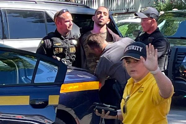 Lebanese-American Hadi Matar, 25, center, was arrested and charged with attempted murder for allegedly stabbing Rushdie. 