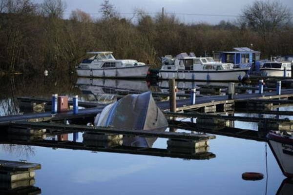A capsized boat in the harbour at Leitrim Village in Co Leitrim. Picture: Niall Carson/PA Wire