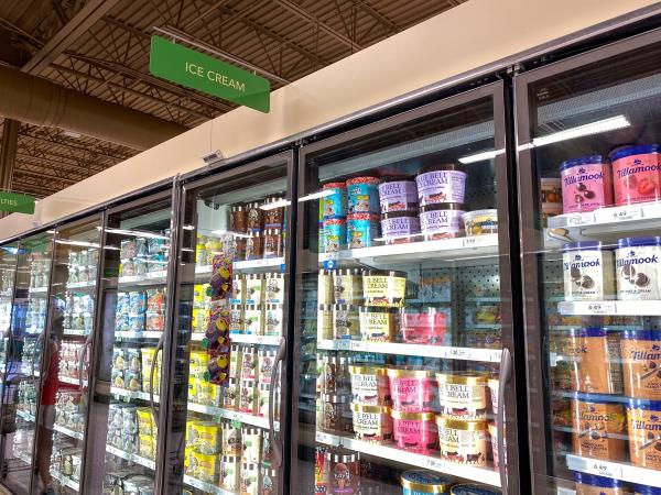 The Ice Cream section of the frozen foods aisle of a Publix grocery store wher<em></em>e all sorts of tasty baked goods are displayed.