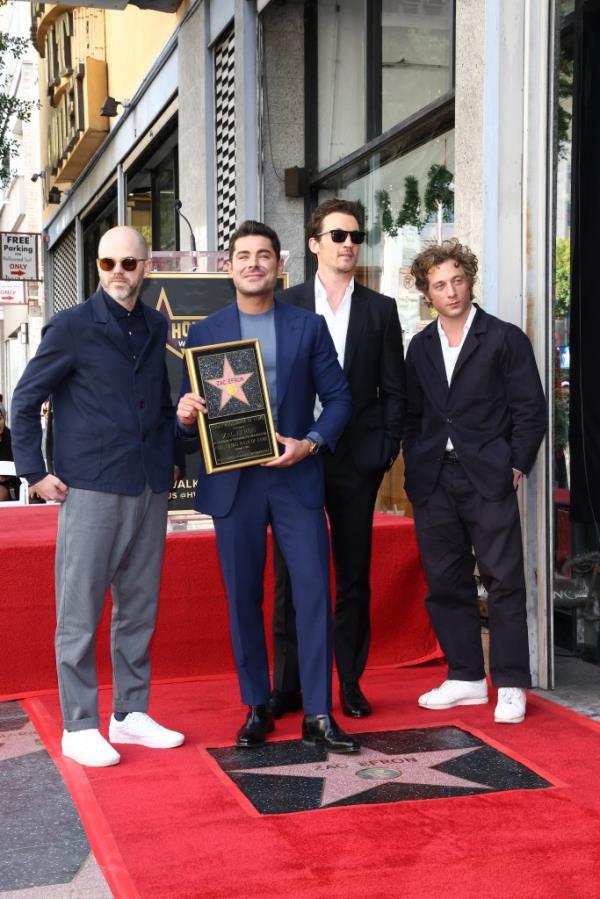 Xac Efron (2nd L) poses with Sean Durkin (L), Miles Teller (2nd R) and Jeremy Allen White during his Hollywood Walk of Fame ceremony.