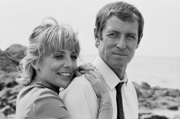 John Nettles and English actress Deborah Grant on the set of television series 'Bergerac' in 1983