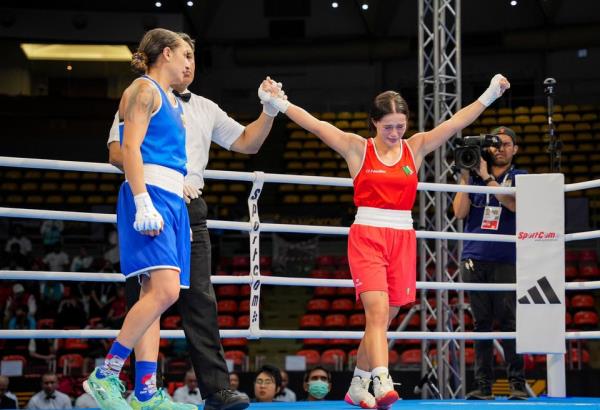 Moorehouse, right, comfortably won her three fights in Thailand, including this victory over Zlatislava Chukanova of Bulgaria, to secure her Olympic slot. Photo: Joe Walsh/Sportsfile