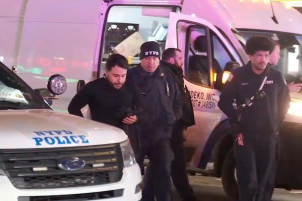 A gunman opened fire toward a bicyclist but instead struck an occupied delivery van at West 36th Street and Seventh Avenue, cops said.